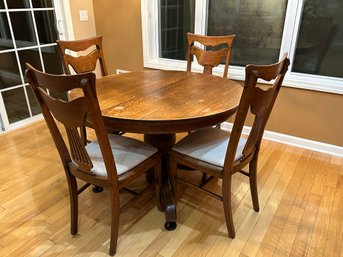 Antqiue Oak Table With Three Leaves On Pedestal Base Along With 4 Antique Chair