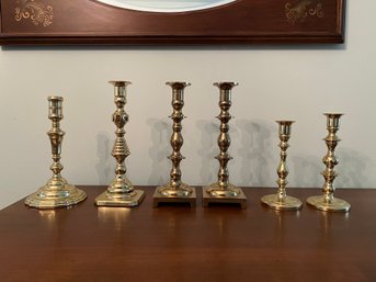 Group Of Polished Brass Candlesticks