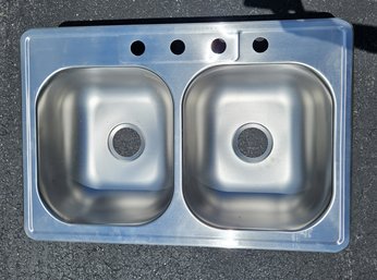 Stainless Steel Double Sink - New. Measures 33 Inches Wide And 22 Inches Front To Back.