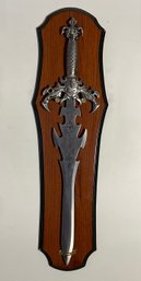 Steel Sword On Decorative Hanging Wooden Plaque.