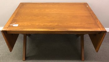 Contemporary Drop Leaf Table With Saw Buck Base