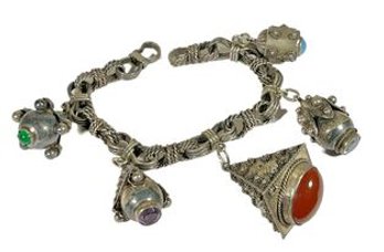 Fine Continental .800 Silver Charm Bracelet Having Gemstones