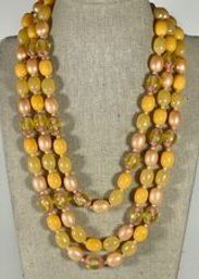 Vintage Faux Pearl And Plastic Peach Colored Multi Strand Beaded Necklace