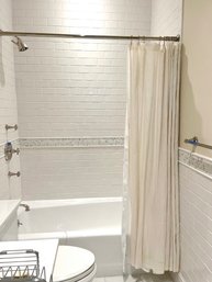 A Restoration Hardware Cream Linen Shower Curtain And Polished Nickel Rod