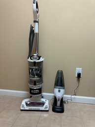 Shark Rotator Professional Vacuum Along With A Dust Buster Type Hand Vacuum