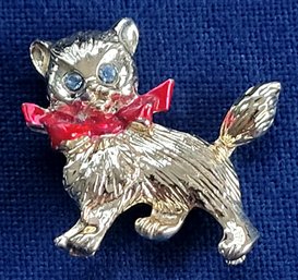 Gold Tone Vintage Cat With Blue Rhinestone Eyes & A Red Bow Brooch