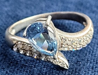 Gorgeous Sterling Silver With Light Blue Stone And Sparkling Details Wrap Around Ring