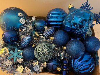 Collection Of Blue Ornaments Overflowing In Box Size 18L X 12W X 3 1/2D