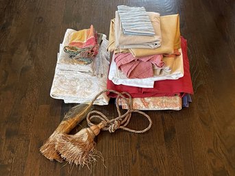 Assorted Sizes Of Linens With A Gorgeous Tassel