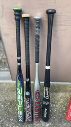 A Group Of Four  Used Baseball Bat With Bag