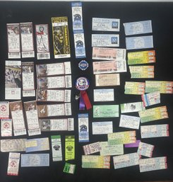 A 1985 PATRIOTS RIBBON, A $50 LAS VEGAS POKER CHIP, AND A COLLECTION OF '80S TICKET STUBS
