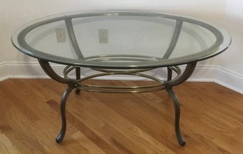Burnished Brass Oval Glass Cocktail Table.