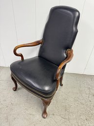 A Vintage Leather Armchair With Nail Head Details