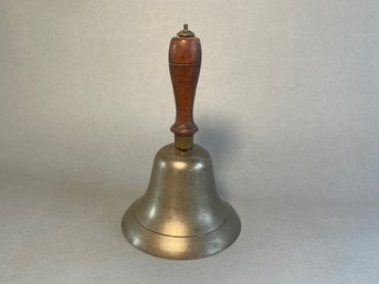 An Antique Brass & Wooden Bell