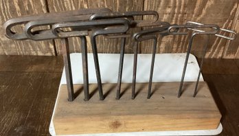 Unique Antique Hand Loop Tools On Wooden Board