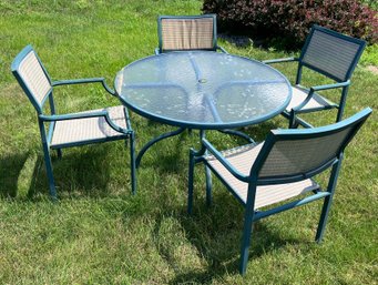 50. Outdoor Glass Top Table With 4 Chairs