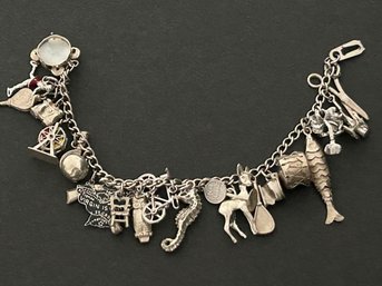 1950's Sterling Silver Charm Bracelet Loaded With Assorted Charms Marked Sterling 6.5 In. Length