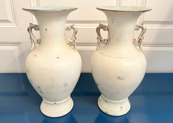 Pair Of Rubbed White Ceramic Urns