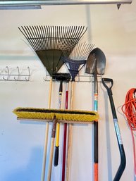 Garage Lot Of Rakes And Brooms