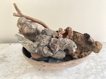 Old Half Gourd Filled With Beach Driftwood And Stones