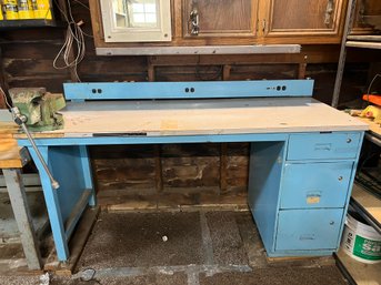 Work Bench With A Light Blue Metal Frame & Power Strip