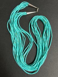 Navajo Hand Crafted 9 Strand Sterling Tip And Clasp Liquid Turquoise Necklace  30 ' Length