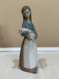 LLadro Girl Holding Pig