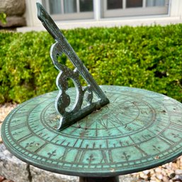 A Copper Top Sun Dial On Metal Base