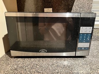 OSTER Stainless Steel Countertop Microwave Oven, Clean