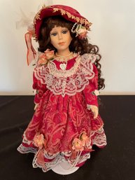 Porcelain Doll In Red Dress