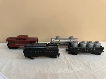 4  Lionel Cars - Caboose, Coal Car,  &  Sunoco