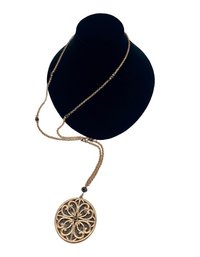 Rose Gold Tone Metal Pendant Necklace With Black Glass Beads