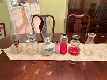 Group Of 4 Oil Lamps And Fluid