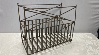 A Vintage Metal Magazine Rack