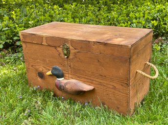 A Wooden Box With Carved Duck