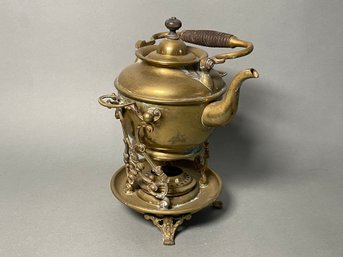 A Vintage Brass Tea Pot With Burner