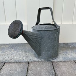 A Galvanized Watering Can