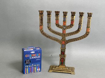 A Gorgeous Brass Menorah With Candles