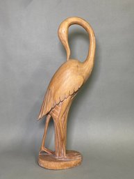 A Pier One Carved Wooden Crane