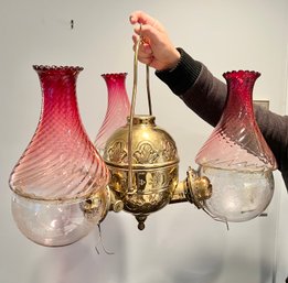 RARE Angle Lamp Co., New York Triple Burner Oil Lamp Fixture With Cranberry Swirl Glass Shades