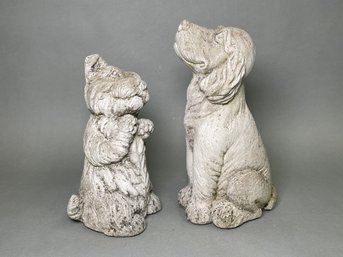 Two Concrete Dog Statues