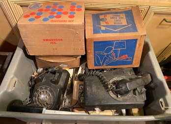 Tote Filled With Antique Telephones Of All Kinds