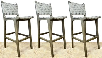 A Trio Of Woven Leather Bar Stools By Pottery Barn