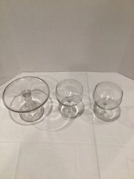 Two Glass Cups And A Cake Holding Plate