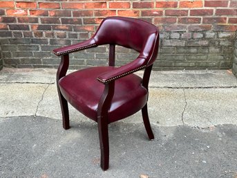 A Burgundy Leather Chair With Nailhead Detail