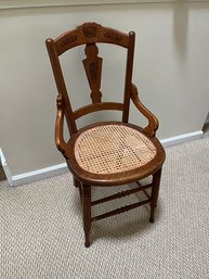 Vintage Antique Wooden Chair With Carving In The Back And Cane Seat