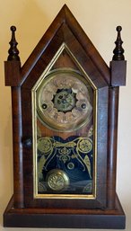 Antique 1886 - Small Gothic Mantle Clock - Waterbury Clock Company - CT - Wooden Case - Glass Decorated Door