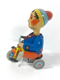 Russian Made Tin Toy Boy On Bicycle