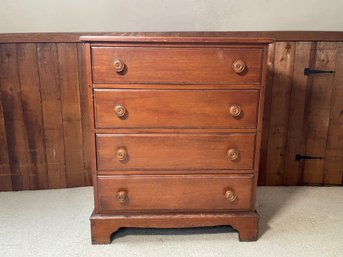 A Solid Wood Four Drawer Dresser