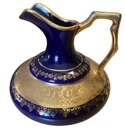 A Hand Painted Limoges Blue And Gold Pitcher